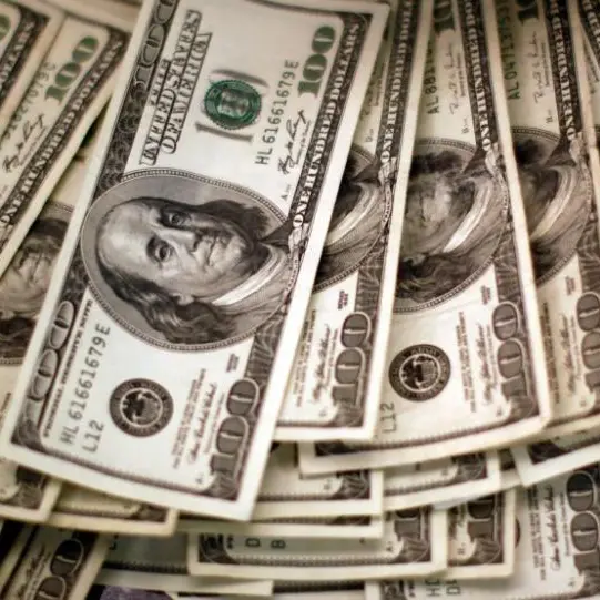 Dollar poised for third weekly gain on trade optimism; Aussie climbs