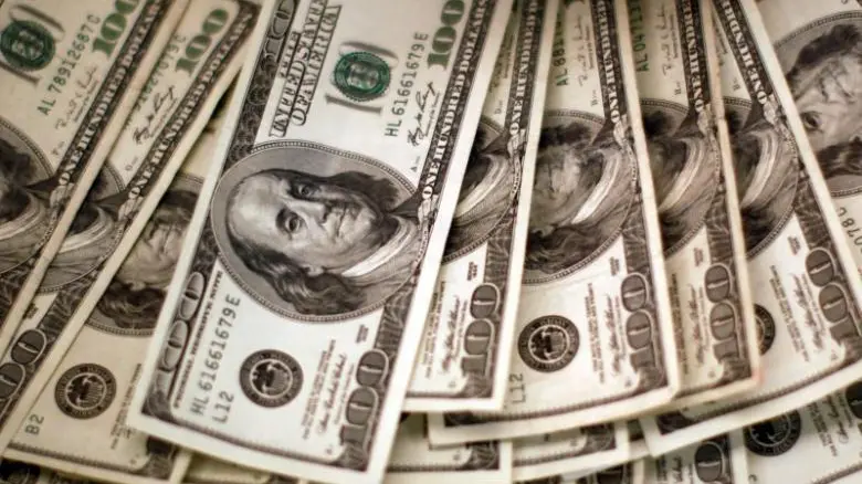 Dollar set for big annual gain as traders brace for high US rates