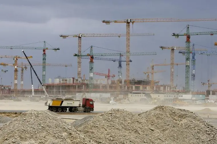 Image used for illustrative purpose. A truck passes the airport terminal at the construction site for the Berlin Brandenburg international airport (BBI) in Schoenefeld outside Berlin, June 3, 2009. REUTERS/Tobias Schwarz , Tobias Schwarz     