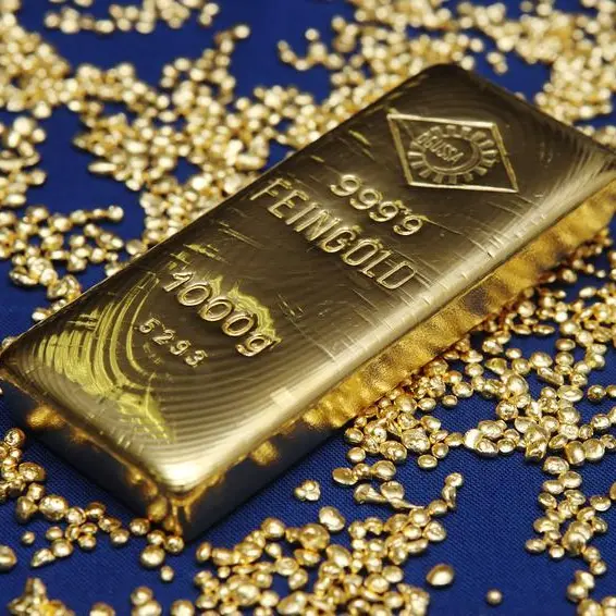 Gold edges higher on dollar pullback as US rate hike bets ebb