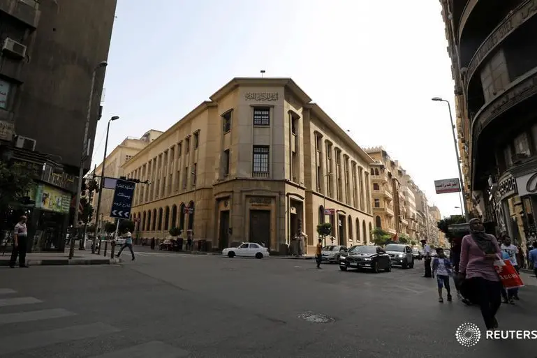 Egyptians walk in front of the central bank in central Cairo, Egypt, June 7, 2017. Mohamed Abd El Ghany, Reuters