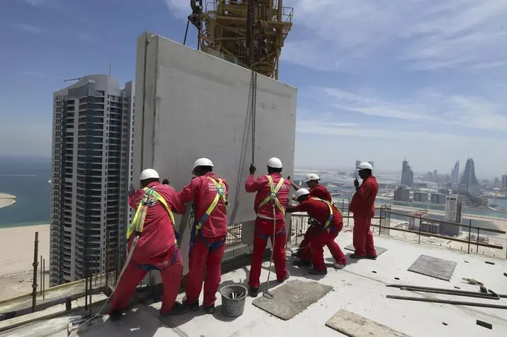 One of the last pre-cast concreate panels, is lifted onto the top of the The Breaker in Manama, May 7, 2014. Image used for illustrative purpose. Hamad I Mohammed, Reuters , Reuters Images