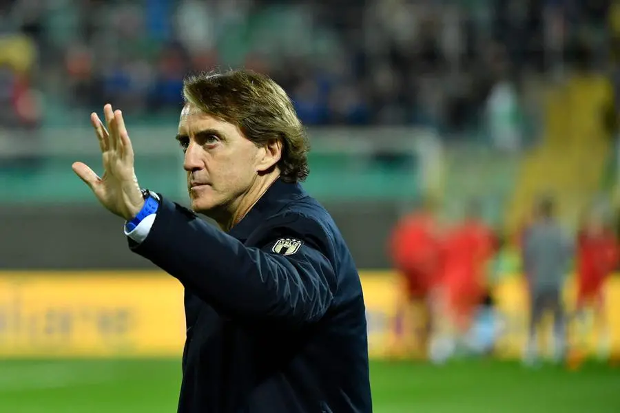 (FILES) Italy\\'s coach Roberto Mancini waves prior to the 2022 World Cup qualifying play-off football match between Italy and North Macedonia, on March 24, 2022 at the Renzo-Barbera stadium in Palermo. Roberto Mancini has resigned as coach of European champions Italy, the Italian Football Federation (FIGC) announced on August 13, 2023. The FIGC said in a statement \"it has taken note of the resignation of Roberto Mancini as coach of the Italian national team received late evening on August 12, 2023\", adding a new coach would be appointed \"in the coming days\". (Photo by Alberto PIZZOLI / AFP) , Agence France-Presse (AFP)/AFP