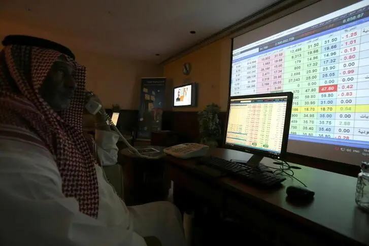 A Saudi trader monitors stock information at ANB Bank in Riyadh, Saudi Arabia December 15, 2020. Ahmed Yosri, Reuters , Reuters Images