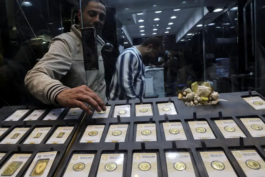 A gold vendor sorts gold bars and coins inside a shop at the gold market area, as gold prices recorded an increase after devaluation of the local currency, in Cairo, Egypt January 12, 2024. REUTERS/Amr Abdallah Dalsh , Reuters
