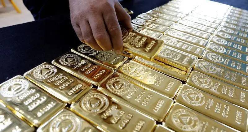 Gold falls on stronger dollar after Trump says he won't fire Powell