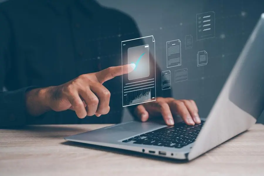 Businesswoman points to ISO certified document, ensuring standard quality control and product quality checklist online. Image used for illustrative purpose. Getty Images , Getty Images