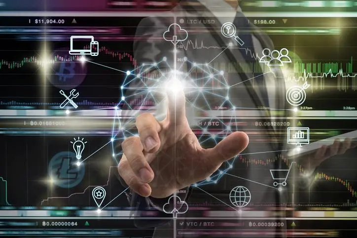 Businessman hand touching the Polygonal brain shape of an artificial intelligence with various icon of smart city Internet of Things Technology over Cryptocurrency Bitcoin exchange trading, AI concept , Getty Images/Getty Images