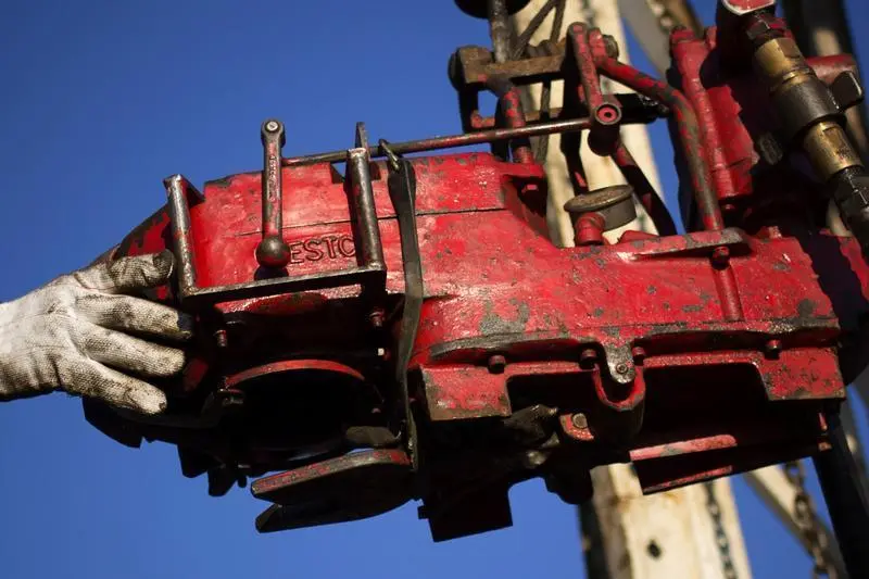 Image used for illustrative purpose. A man works on the rig of an oil drilling pump site in McKenzie County outside of Williston, North Dakota March 12, 2013. , Shannon Stapleton 
