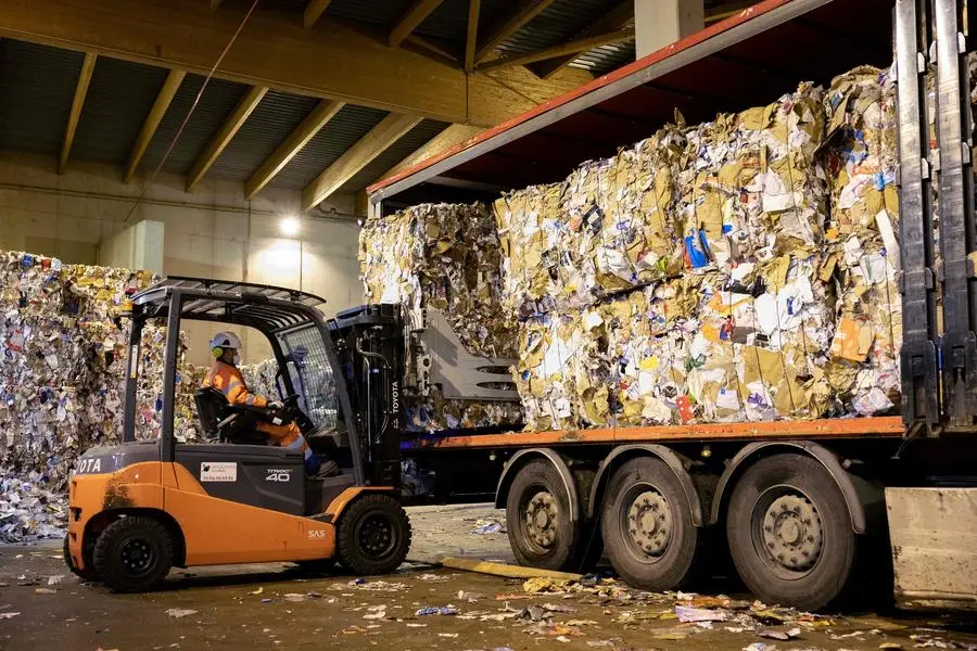 <p>Photo used for illustrative purpose only. An employee loads the stacks of recyclable trash on a truck at the Syctom waste management company in Paris.</p>\\n , Agence France-Presse (AFP)/AFP