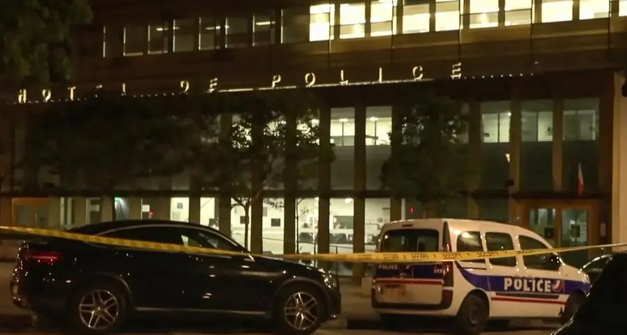 Man shoots 2 officers in Paris police station after grabbing gun