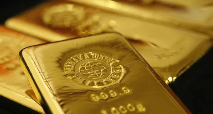 Gold gains on softer dollar; Iran-US talks in focus