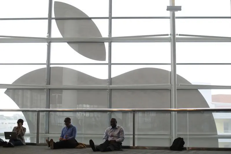 Attendees sit in front of an Apple logo at the Apple Worldwide Developers Conference (WWDC) 2013 in San Francisco, California June 10, 2013. REUTERS/Stephen Lam (UNITED STATES - Tags: BUSINESS SCIENCE TECHNOLOGY) - RTX10IP7 , Reuters Images