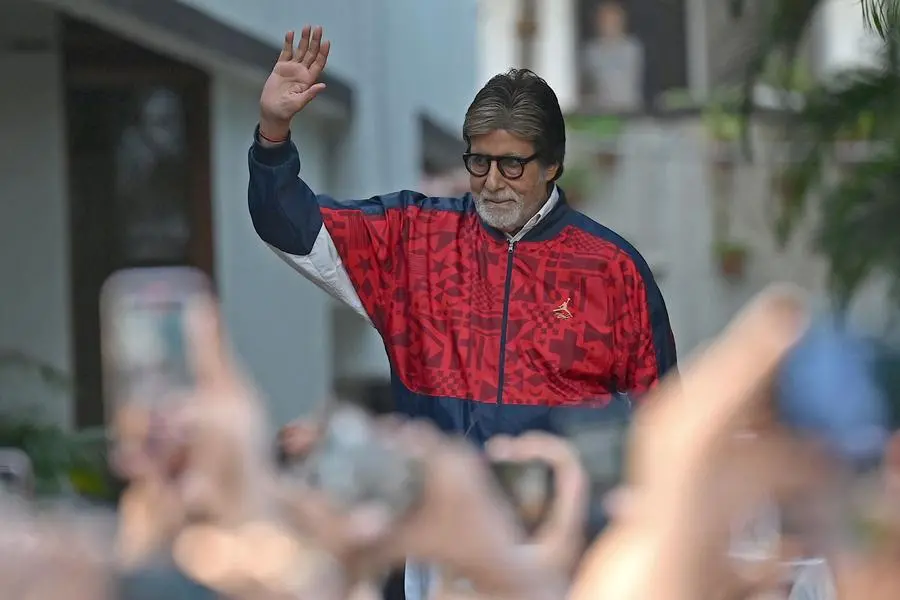 Bollywood actor Amitabh Bachchan greets fans outside his residence on the occasion of his golden jubilee wedding anniversary in Mumbai on June 4, 2023. (Photo by Sujit JAISWAL / AFP) , Agence France-Presse (AFP)/AFP