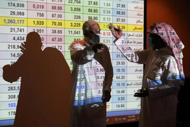 Saudi traders are seen as they monitor stock information at the Saudi stock market in Riyadh, Saudi Arabia August 25, 2020. REUTERS/Ahmed Yosri , REUTERS
