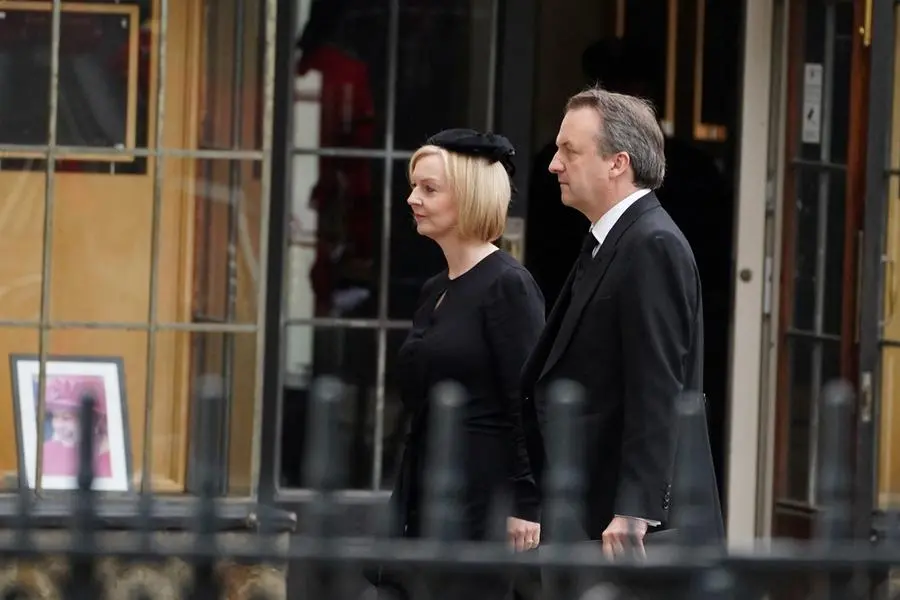 Prime Minister Liz Truss and husband Hugh O'Leary arrive at the State Funeral of Queen Elizabeth II, held at Westminster Abbey, London.Picture date: Monday September 19, 2022. James Manning/Pool via REUTERS