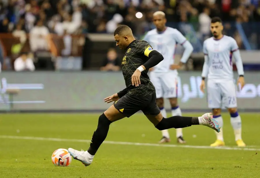 Soccer Football - Friendly - Saudi Pro League XI v Paris St Germain - King Fahd International Stadium, Riyadh, Saudia Arabia - January 19, 2023 Paris St Germain's Kylian Mbappe scores their fourth goal from the penalty spot REUTERS/Ahmed Yosri