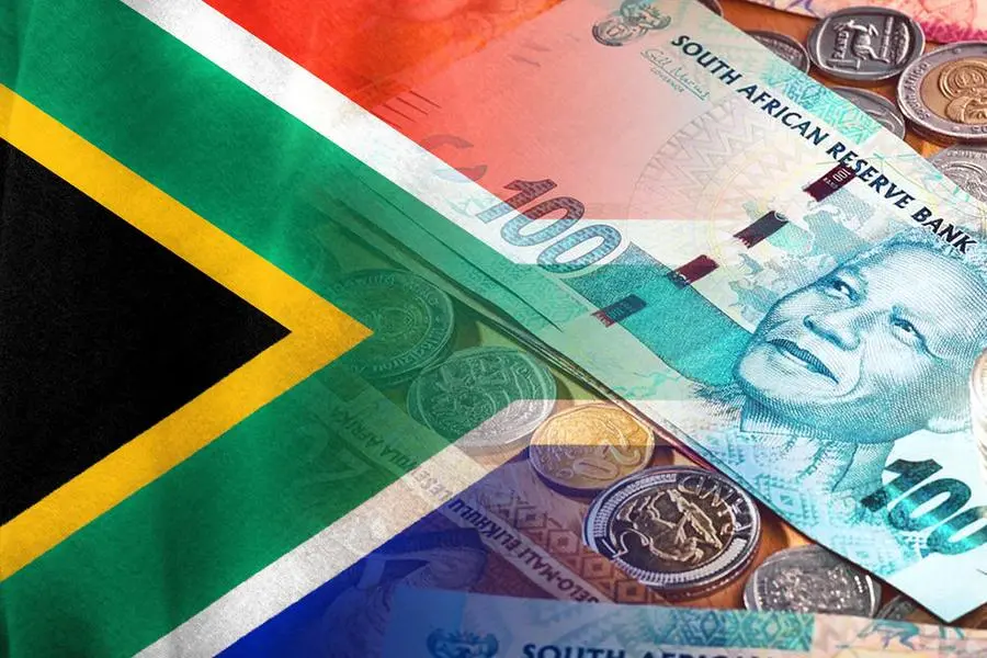 South African flag and South African Rand cash bills and coins. Getty Images Image used for illustrative purpose. , Getty Images