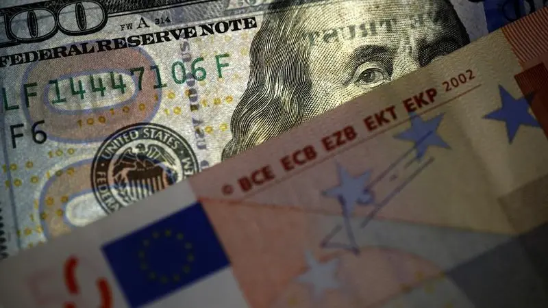 Euro edges down, dollar hovers around two-year high