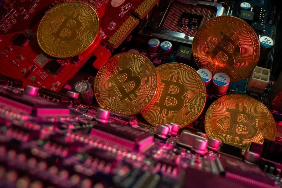 Representations of cryptocurrency Bitcoin are placed on a PC motherboard, in this illustration taken June 16, 2023. REUTERS/Dado Ruvic/Illustration , Reuters
