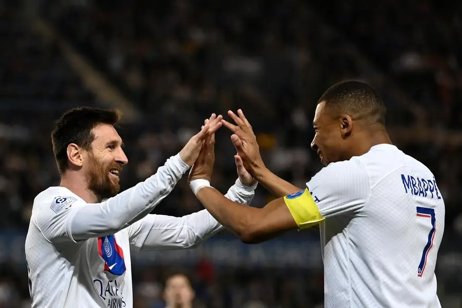 (FILES) Paris Saint-Germain\\'s Argentine forward Lionel Messi celebrates with Paris Saint-Germain\\'s French forward Kylian Mbappe after scoring his team\\'s first goal during the French L1 football match between RC Strasbourg Alsace and Paris Saint-Germain (PSG) at Stade de la Meinau in Strasbourg, eastern France on May 27, 2023. - Despite some fine goals and inspired passes, Lionel Messi\\'s time at Paris Saint-Germain did not leave the lasting impression he had hoped for, ending his two seasons with whistles and an unauthorised outing. (Photo by Jean-Christophe Verhaegen / AFP)
