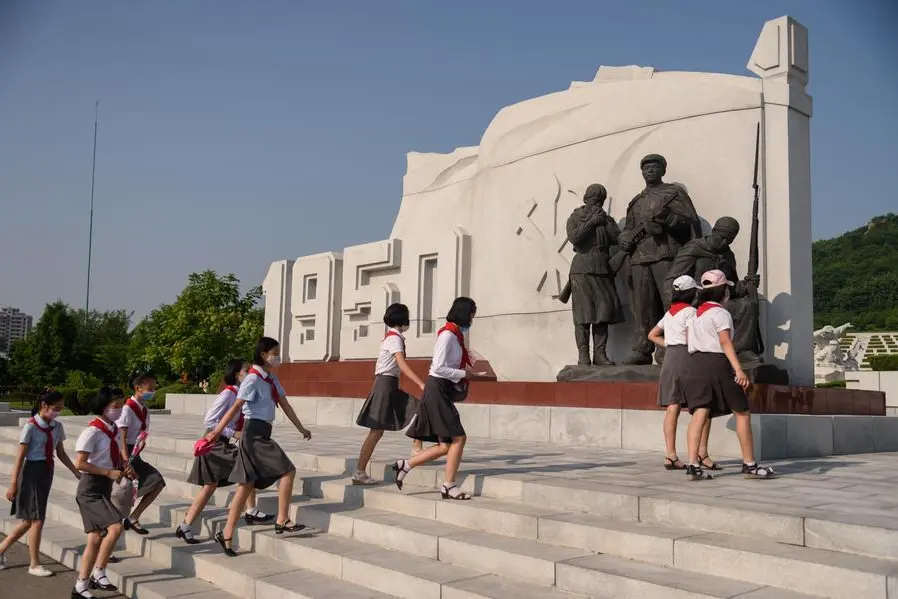 Students visit the Fatherland Liberation War Martyrs Cemetery as part of events marking the occasion of the 68th anniversary of the end of the Korean War, which North Korea calls the \\'Day of Victory in the Great Fatherland Liberation War\\', in Pyongyang on July 27, 2021. North and South Korea signalled a surprise thaw in relations announcing the restoration of cross-border communications that were severed more than a year ago and an agreement between their two leaders to improve ties. The joint announcement, which coincided with the anniversary of the end of the Korean War, was the first positive development since a series of summits between the North\\'s Kim Jong Un and the South\\'s President Moon Jae-in in 2018 failed to achieve any significant breakthrough. (Photo by KIM Won Jin / AFP)