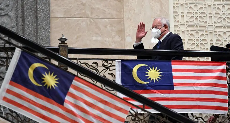 Malaysia's ex-PM Najib jail term halved to six years