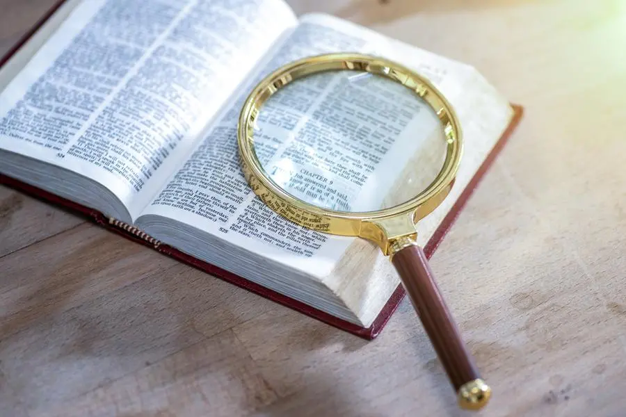 Open book and magnifying glass.. Image Courtesy: Getty Images , Getty Images/Getty Images
