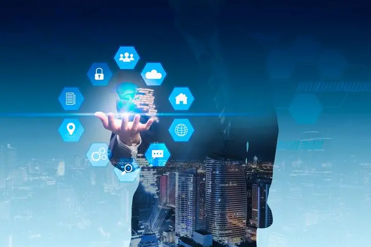 Double exposure business man with social media and digital technology. cityscape background. , Getty Images/Getty Images