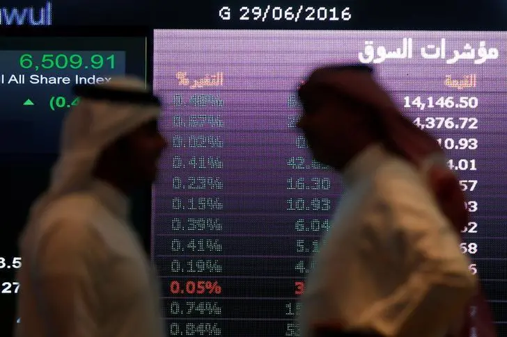 Investors talk with each other as they monitor a screen displaying stock information at the Saudi Stock Exchange (Tadawul) in Riyadh, Saudi Arabia June 29, 2016. , Reuters Images/Faisal Al Nasser 