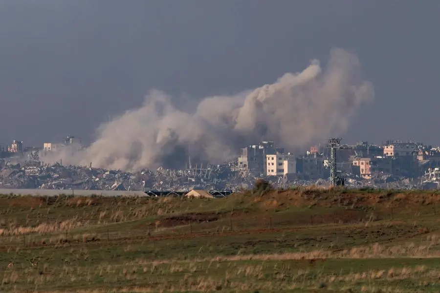 A picture taken in southern Israel near the border with the Gaza Strip on December 12, 2023, shows smoke billowing during Israeli bombardment on northern Gaza, amid continuing battles between Israel and the militant group Hamas. Israel was facing mounting international pressure on December 13 over its war in Gaza, with even key backer the United States criticising the \"indiscriminate\" bombing. (Photo by Menahem KAHANA / AFP) , Agence France-Presse (AFP)/AFP