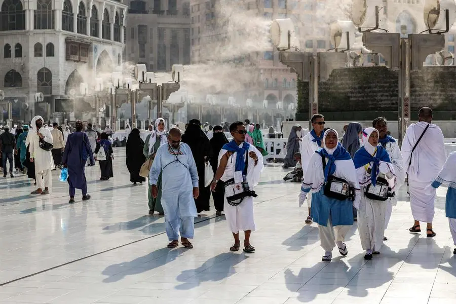 Fans blow air mixed with water vapour to cool off Muslim pilgrims walking at the Grand Mosque in Saudi Arabia\\'s holy city of Mecca on June 4, 2024 ahead of the annual hajj pilgrimage. (Photo by Abdel Ghani BASHIR / AFP) , Agence France-Presse (AFP)/AFP