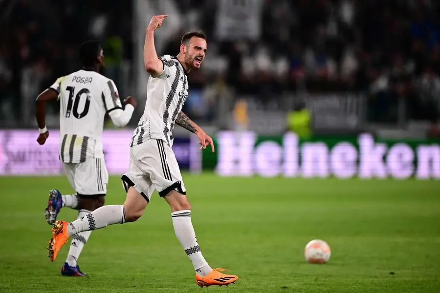 Juventus\\' Italian defender Federico Gatti celebrates after scoring an equalizer during the UEFA Europa League semi-final first leg football match between Juventus and Sevilla on May 11, 2023 at the Juventus stadium in Turin. (Photo by Marco BERTORELLO / AFP) , Agence France-Presse (AFP)/AFP