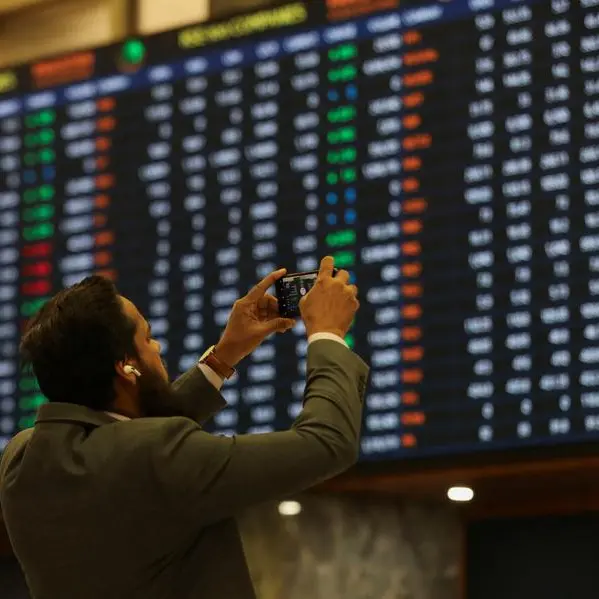 Pakistan's benchmark share index closes at record high