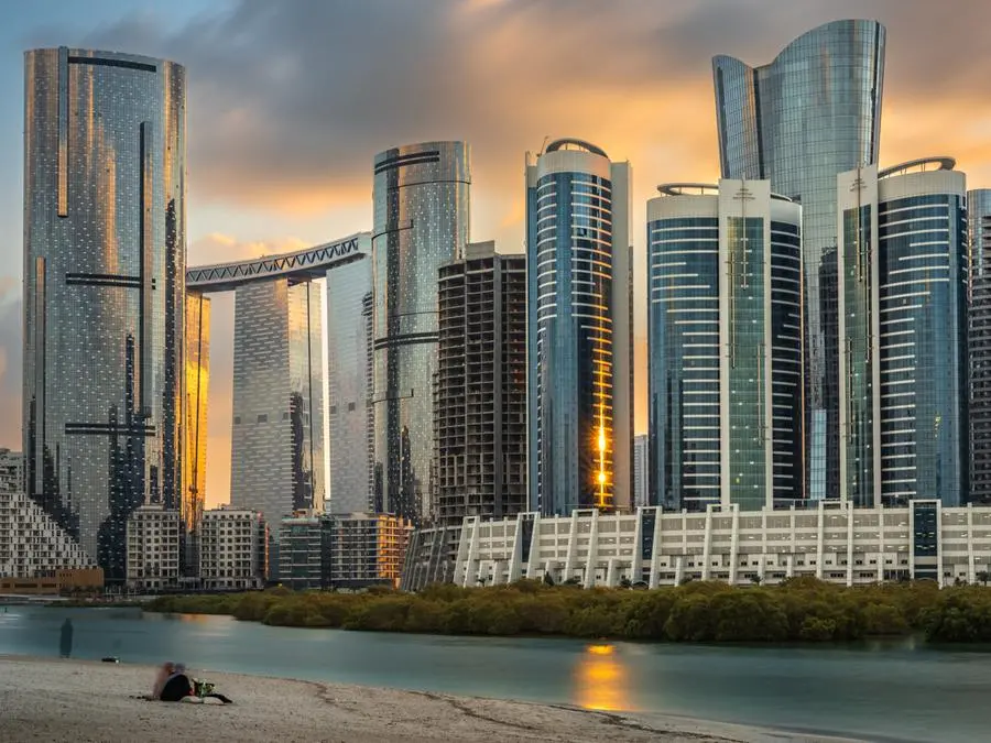 A long exposure shot taken before sunset time in Al-Reem Island in Abu Dhabi, the Capital of UAE end of January 2021, it shows different new modern buildings and blurred person sitting on the adjacent beach. Getty Images Image used for illustrative purpose.