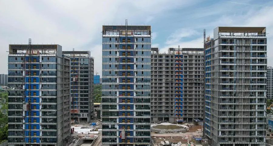 China offers to buy up commercial housing to boost property market