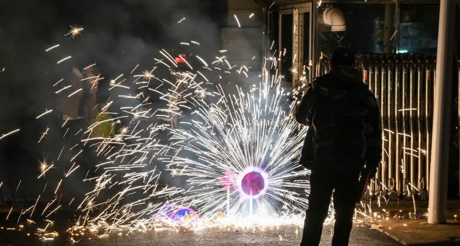 Fireworks, flowers in Wuhan for Lunar New Year but grief lingers
