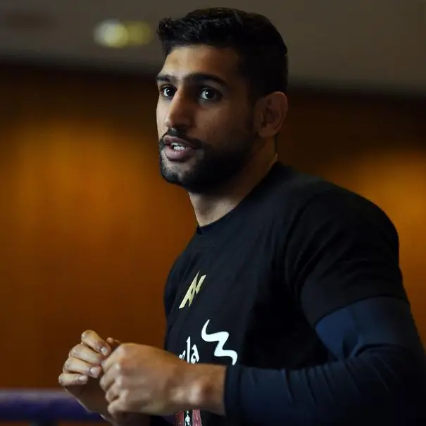 Ex-world champion Khan handed two-year ban for doping