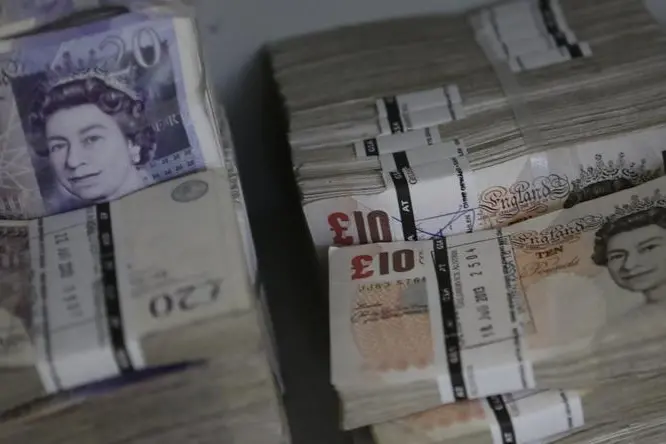 Wads of British Pound Sterling banknotes are stacked in piles at the GSA Austria (Money Service Austria) company\\'s headquarters in Vienna July 22, 2013. Leonhard Foeger, Reuters , Reuters Images