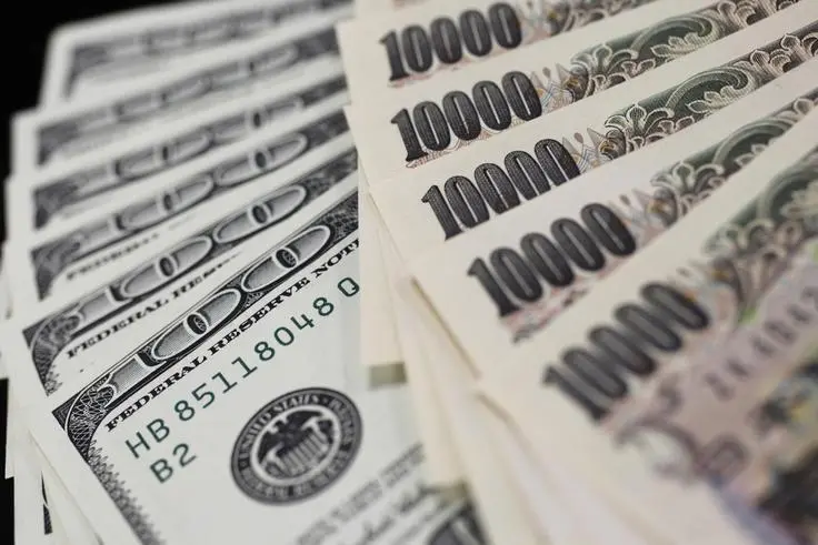 A picture illustration shows U.S. 100 dollar bank notes and Japanese 10,000 yen notes taken in Tokyo August 2, 2011. , Reuters Images/Yuriko Nakao 