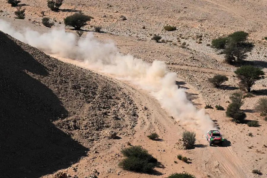 Overdrive Racing\\'s Saudi driver Yazeed Al Rajhi and his German co-driver Timo Gottschalk compete during Stage 4 of the Dakar Rally 2024, between Al Salamiya and Al Hofuf, Saudi Arabia, on January 9, 2024. (Photo by PATRICK HERTZOG / AFP) , Agence France-Presse (AFP)/AFP