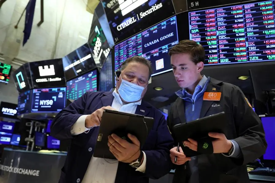 Traders work on the floor of the New York Stock Exchange (NYSE) in New York City, U.S., March 21, 2022. REUTERS/Brendan McDermid