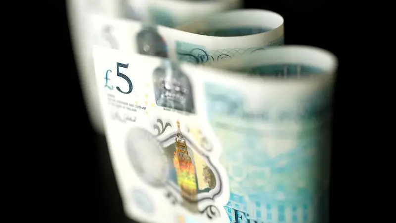 Sterling steadies after strong British activity data