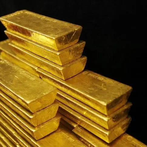 Gold dips as dollar edges higher, investors seek more Fed cues