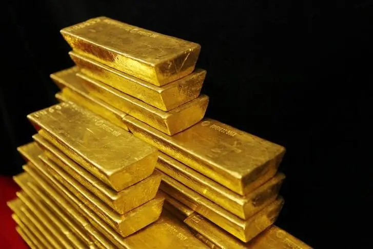 Gold firms in thin trade as investors weigh Fed outlook