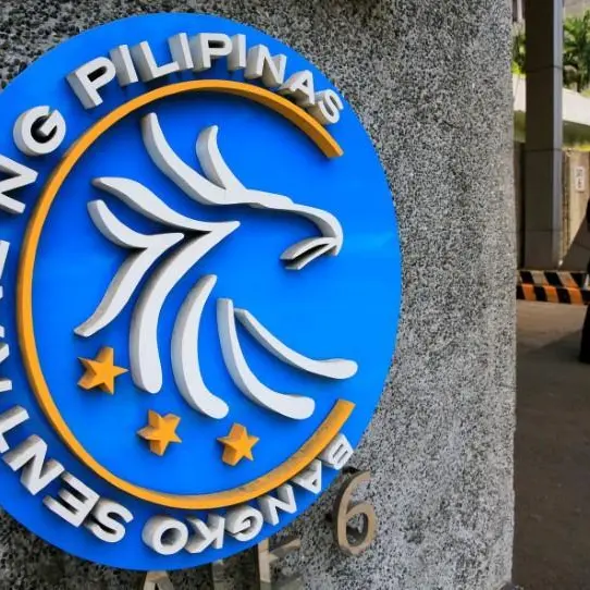 Philippine central bank cuts rates, flags more easing