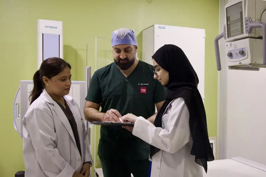 Dr. Thaer reviewing case. Image Courtesy: Medcare