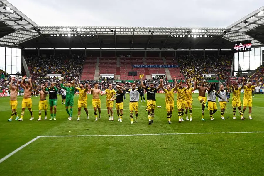 Dortmund\\'s players celebrate after the German Cup 1st round football match between TSV Schott Mainz and Borussia Dortmund in Mainz, western Germany on August 12, 2023. (Photo by Kirill KUDRYAVTSEV / AFP) / DFB REGULATIONS PROHIBIT ANY USE OF PHOTOGRAPHS AS IMAGE SEQUENCES AND QUASI-VIDEO. , Agence France-Presse (AFP)/AFP