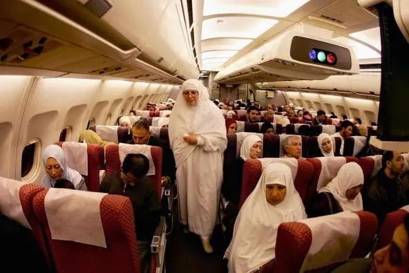 AMMAN, JORDAN - JANUARY 12: Jordanian muslim pilgrims are seen during their flight to Saudi Arabia at Al-maleka A\\'alya airport on January 12, 2005 in Amman, Jordan. Muslims from around the world are making the annual Hajj Pilgrimage to the Islamic holy site of Mecca. (Photo by Abid Katib/Getty Images) , Getty Images