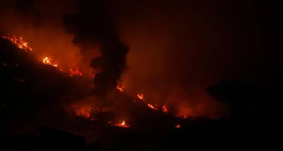 Hundreds battle wildfire threatening S. Africa naval base